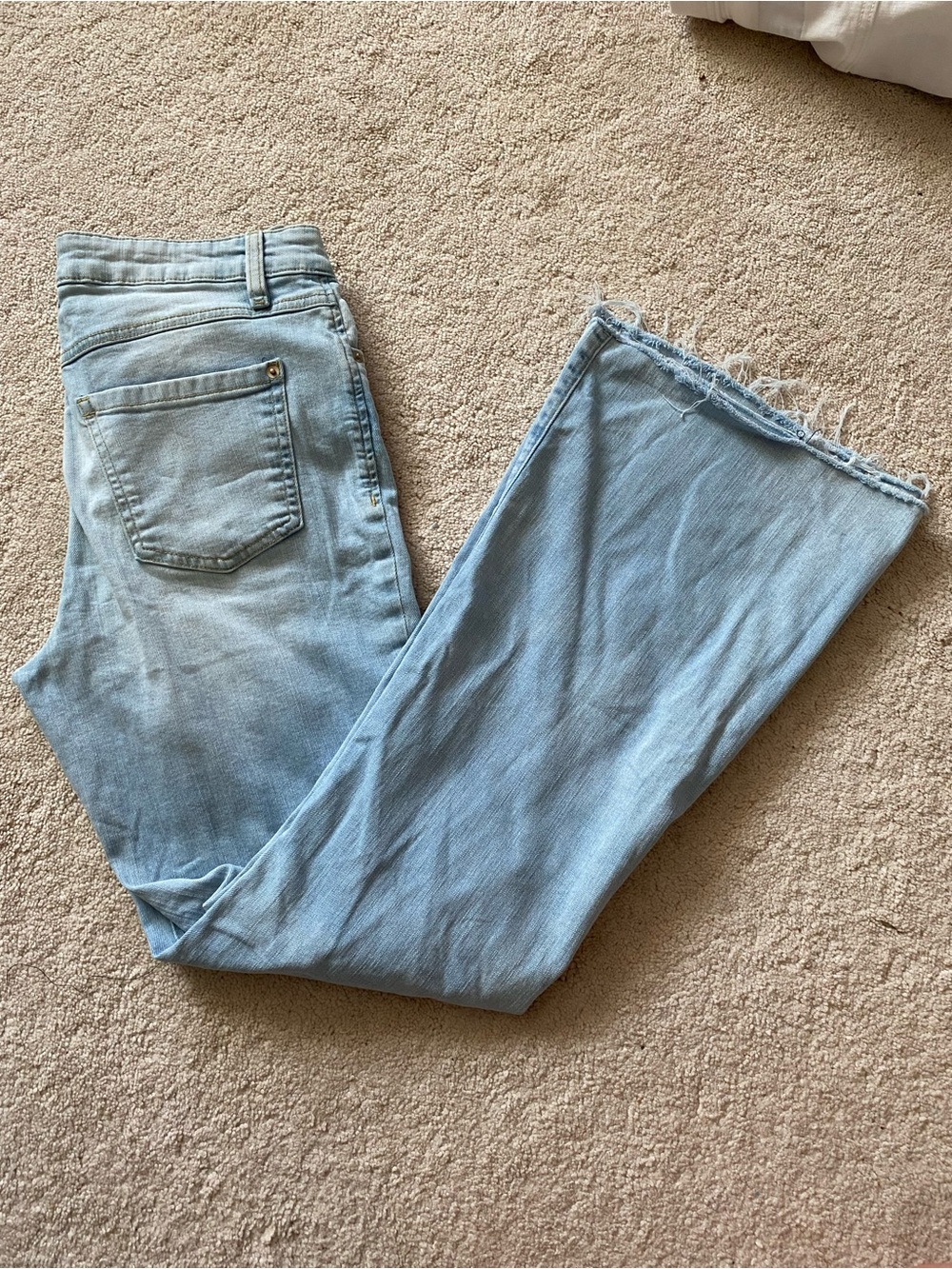 Womans Light Blue Flaired Denim Jeans — Frayed Hem